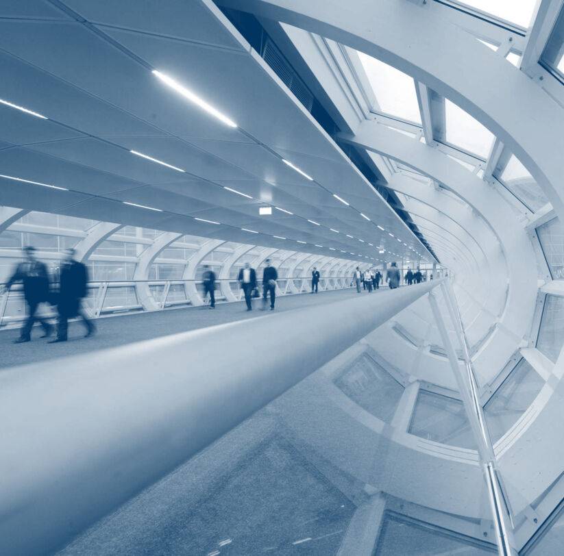 The skywalk of the Hamburg Messe und Congress with walking people