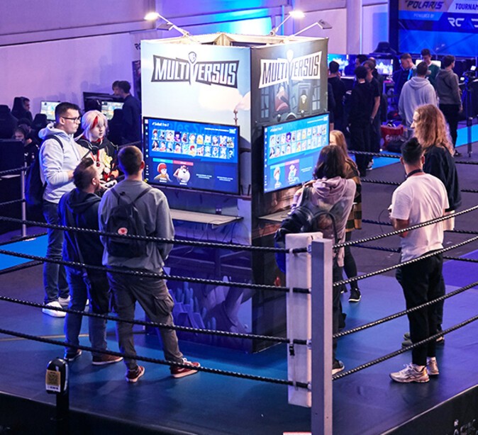Visitors standing around screens at the POLARIS Convention 2022