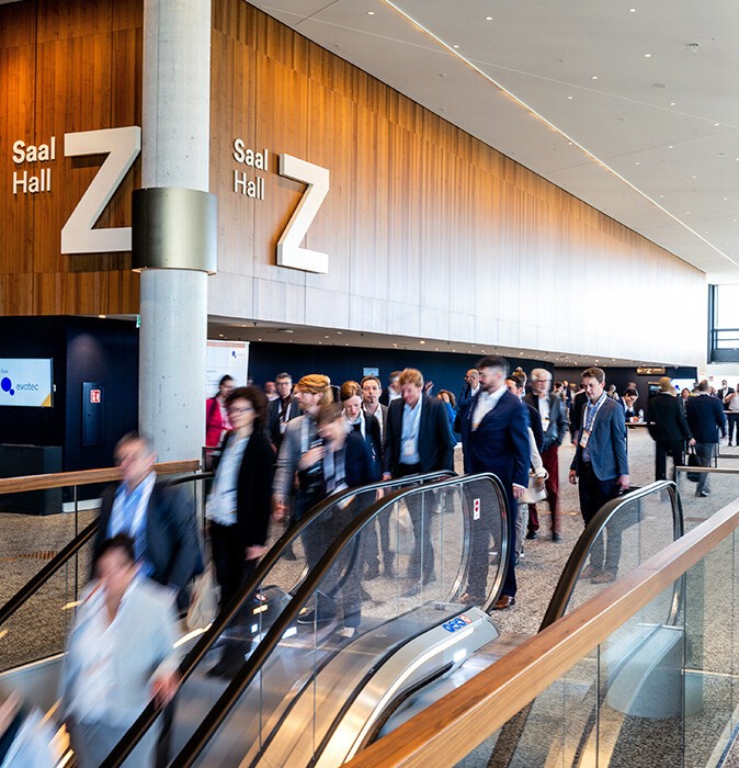 People at the escalator inside the CCH
