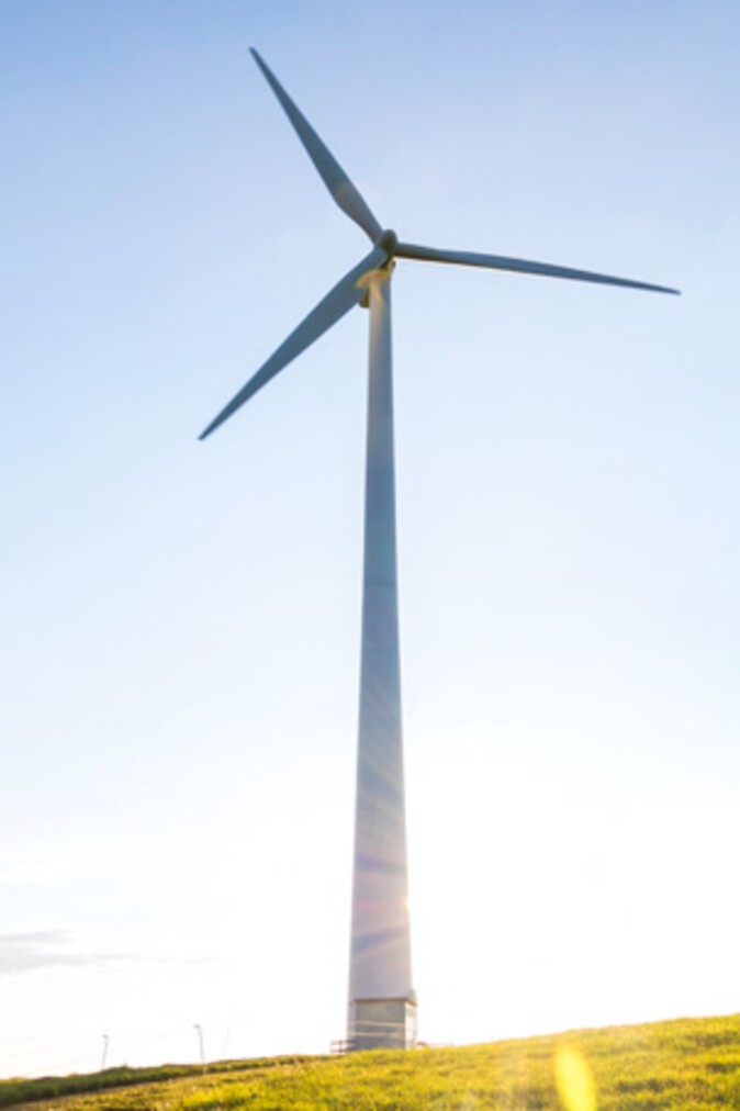 A wind turbine in the sun
