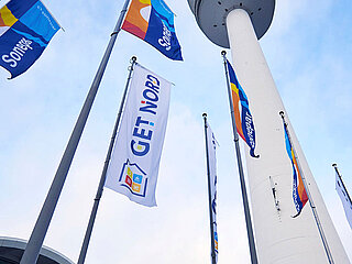 GET NORD - Flags and TV tower at the Central Entrance