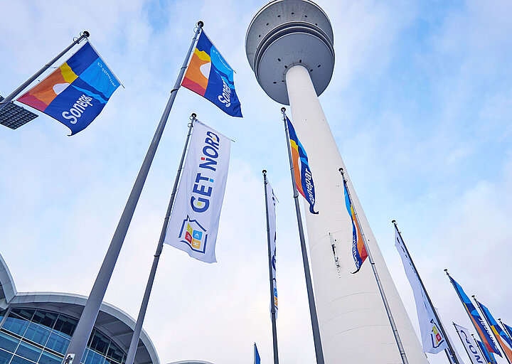 GET NORD - Flags and TV tower at the Central Entrance