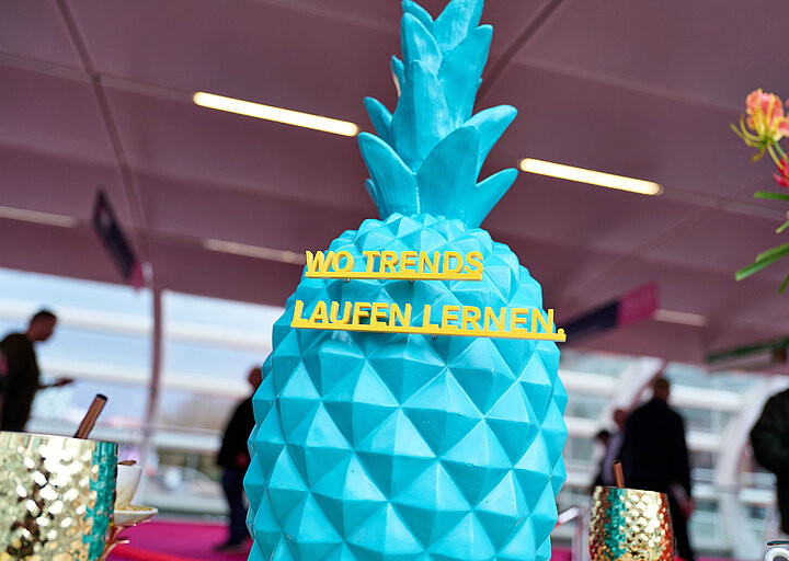 INTERNORGA | blue pineapple with claim ‘Where trends learn to walk’