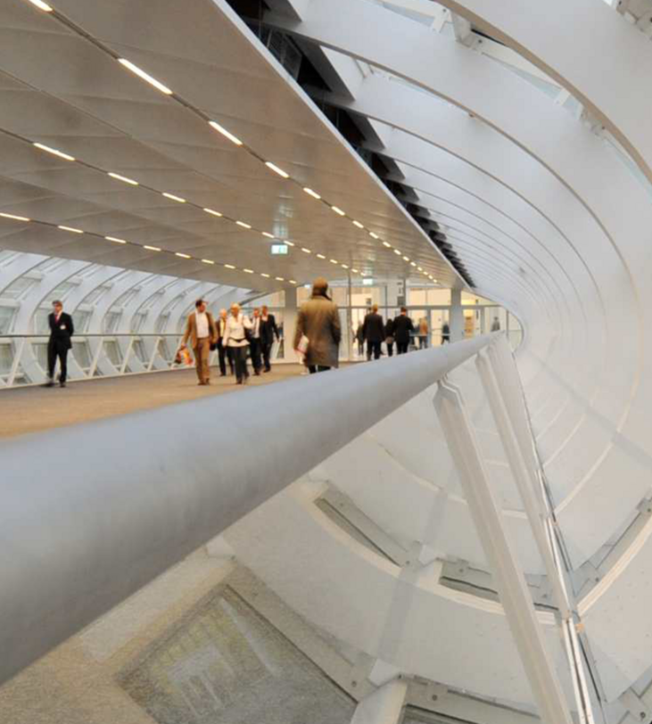 The skywalk of the Hamburg Messe und Congress with walking people